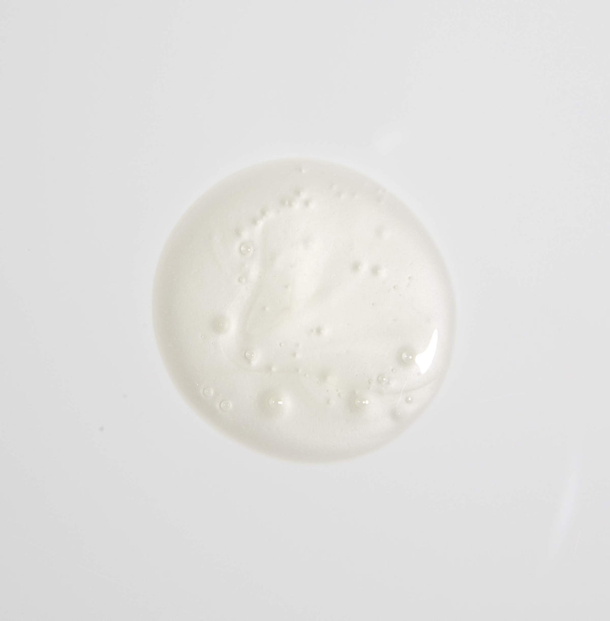 MALIN+GOETZ shampoo being applied in shower demonstrating easy rinse and manageability