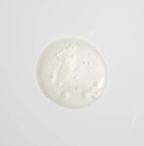 MALIN+GOETZ shampoo being applied in shower demonstrating easy rinse and manageability