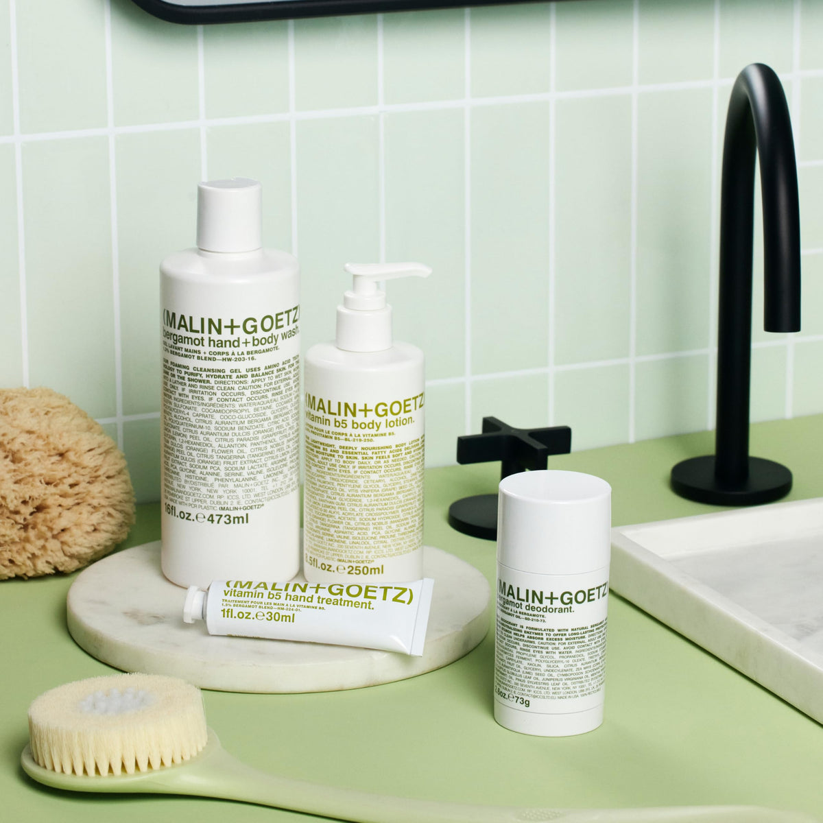 MALIN+GOETZ back label close-up with ingredients, transparent clean-formula benefit