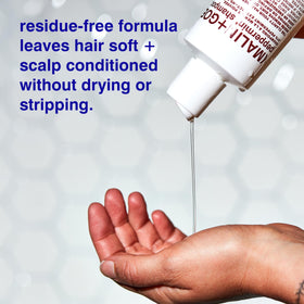 MALIN+GOETZ shampoo lather in hand demonstrating gentle foaming action