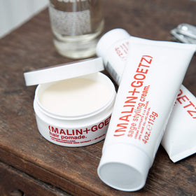 MALIN+GOETZ label close-up emphasizing ingredient list and vegetarian claim