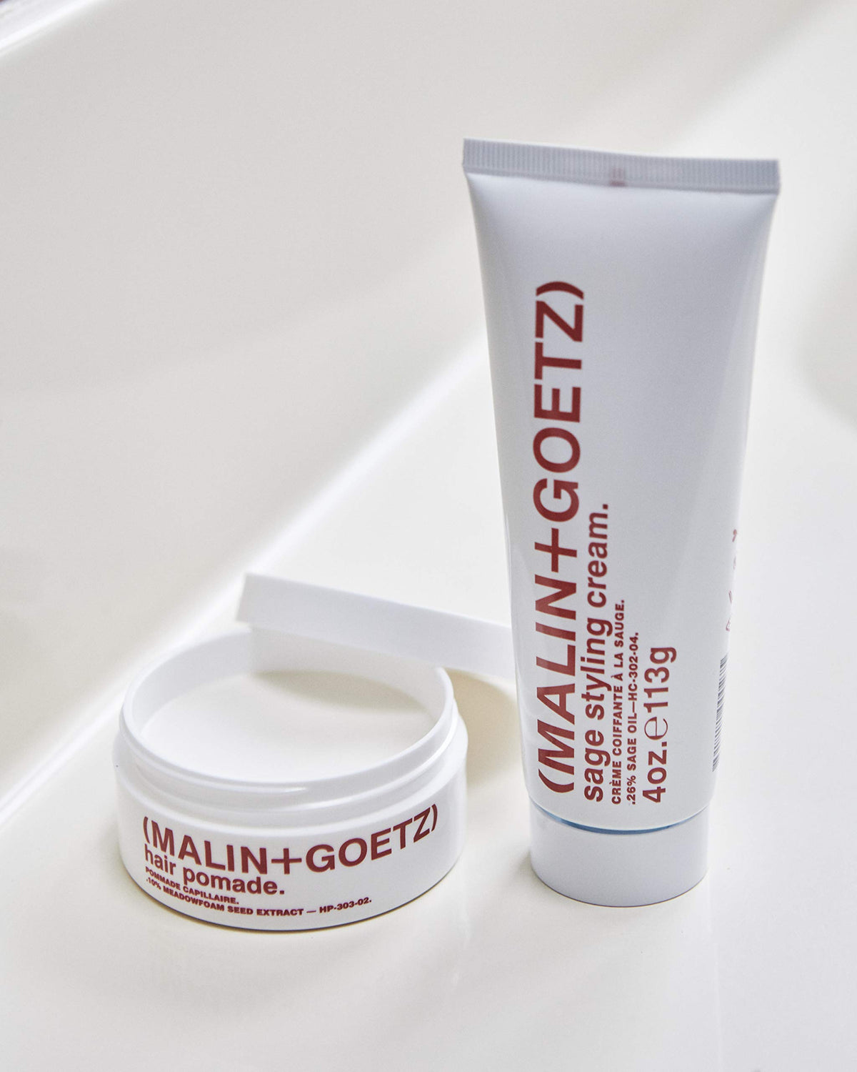 MALIN+GOETZ pomade on bathroom shelf in everyday routine setting