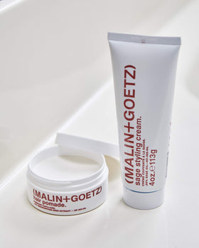 MALIN+GOETZ pomade on bathroom shelf in everyday routine setting