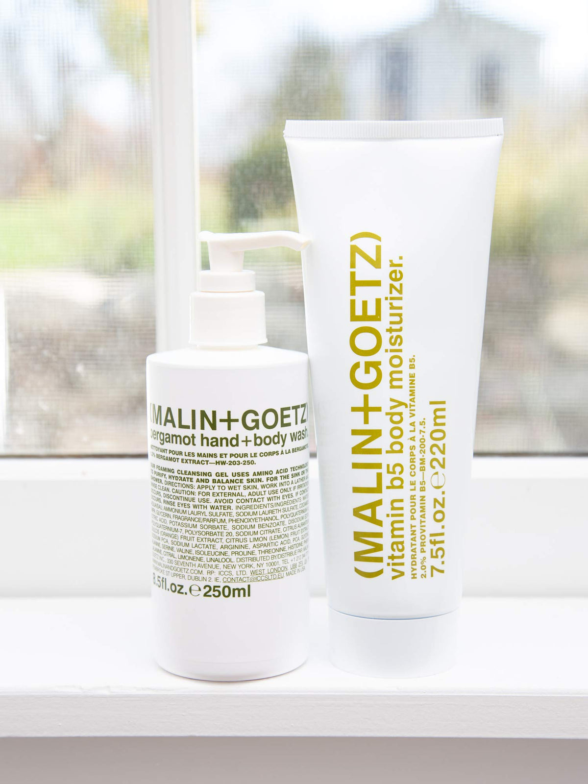 MALIN+GOETZ pump dispensing foam close-up showing mild cleansing action benefit