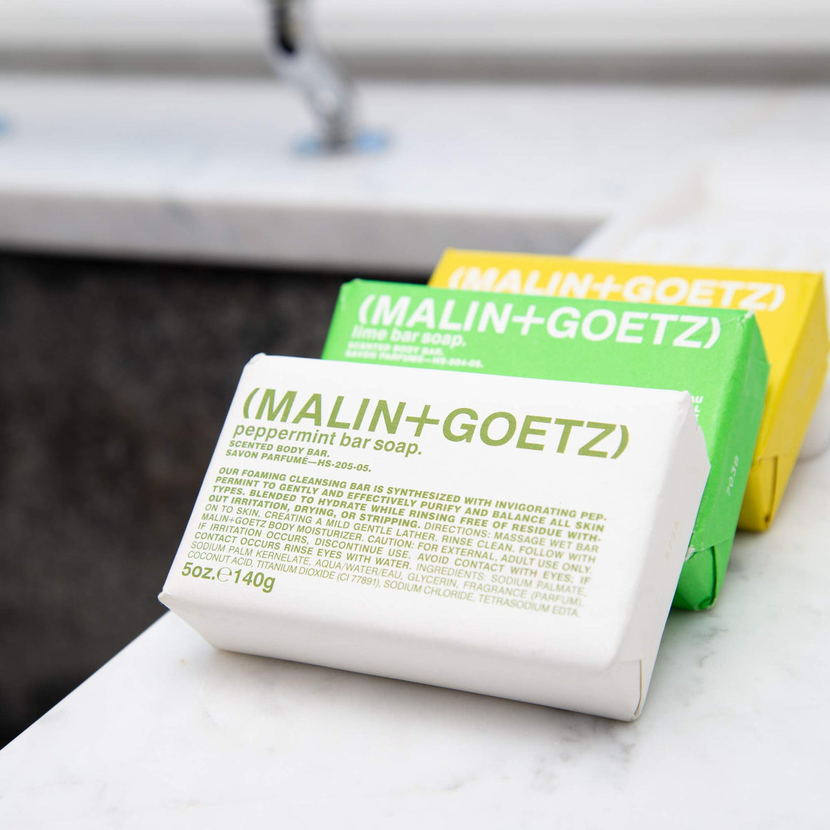 MALIN+GOETZ rum bar on bathroom soap dish, demonstrates daily use convenience