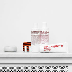 MALIN+GOETZ before and after hair image showing reduced frizz and added shine