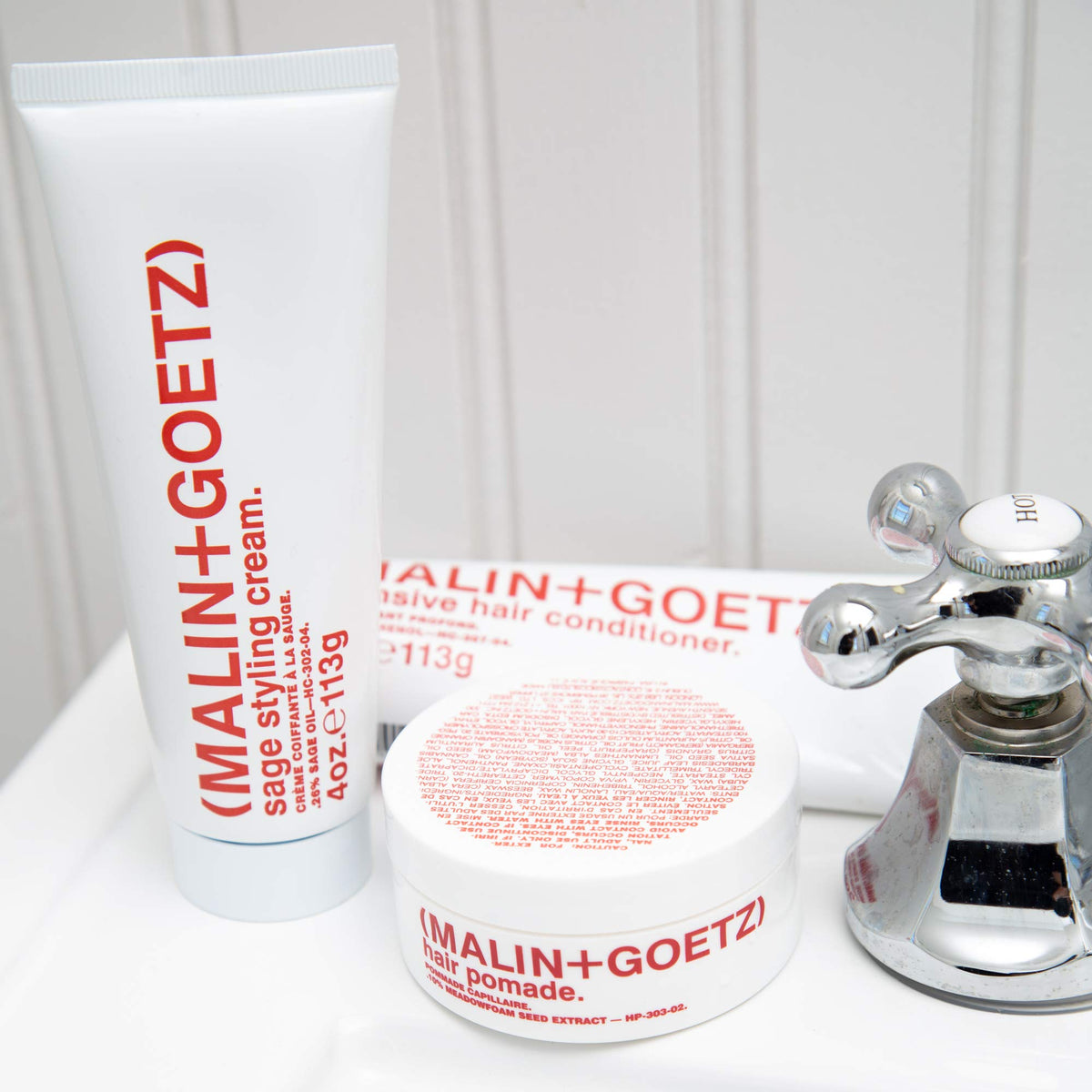MALIN+GOETZ product on vanity in bathroom setting suggesting daily styling ritual