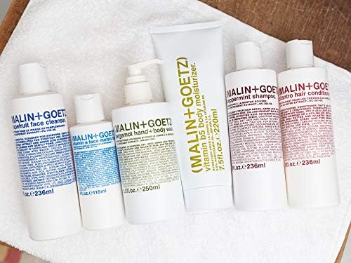 MALIN+GOETZ moisturizer being smoothed onto skin showing calming and hydrating benefit