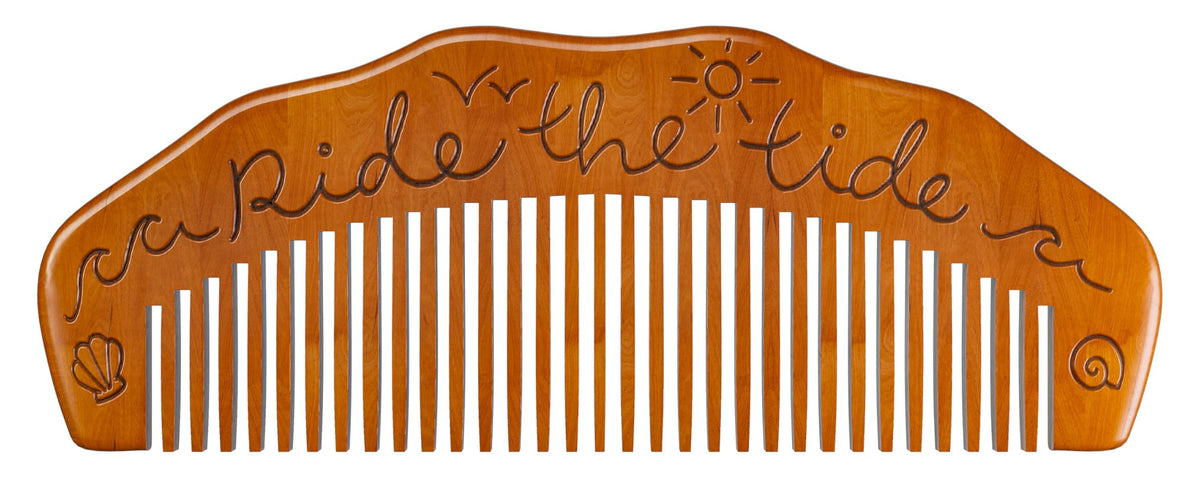 Mama Natural comb inside a packed birth bag illustrating portability