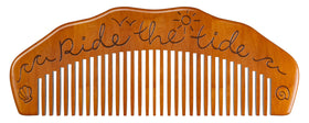 Mama Natural comb inside a packed birth bag illustrating portability