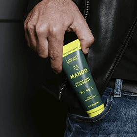 Mando used on feet near shoes showing freshness and odor prevention benefit