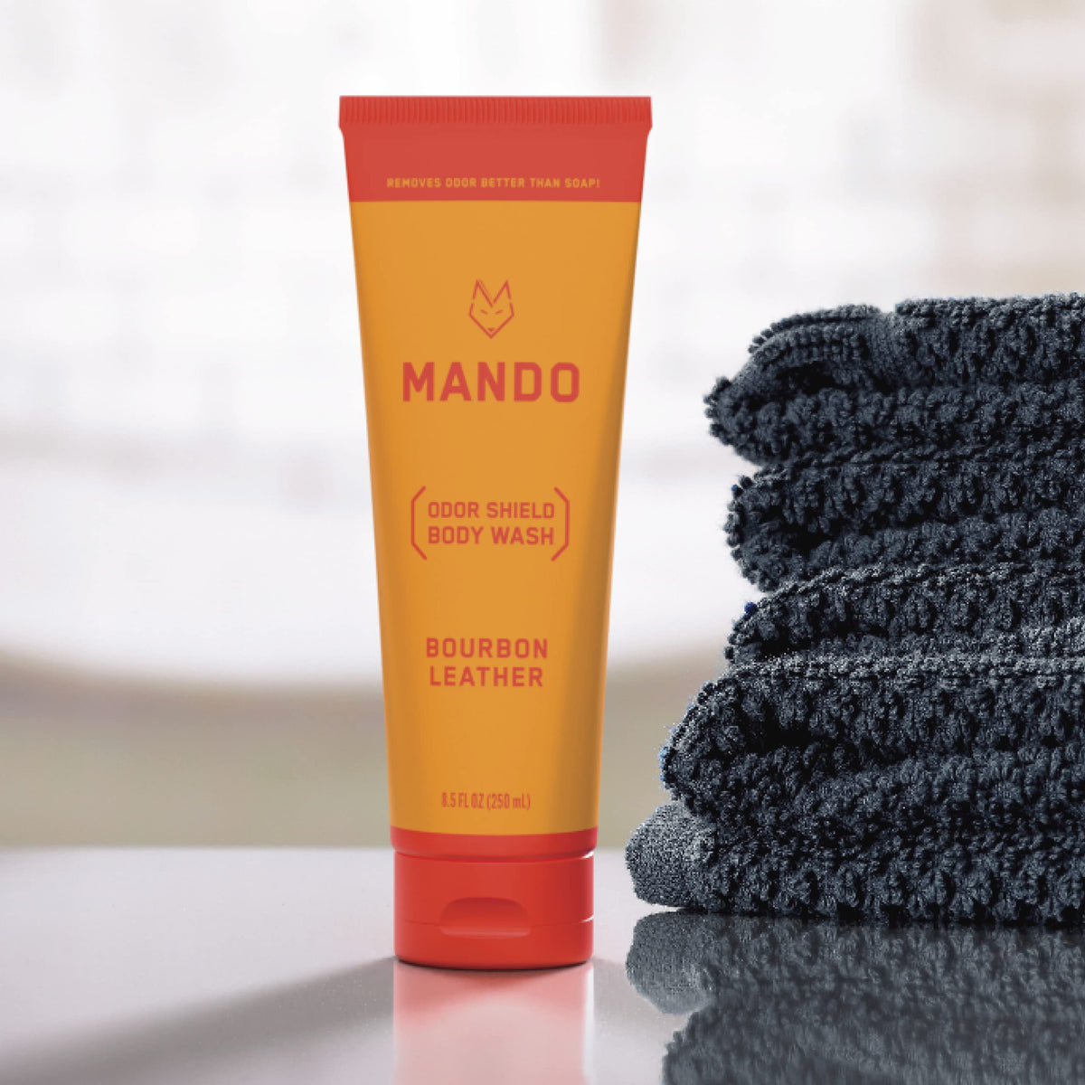 Mando next to a ruler showing 8.5 ounce size for scale and travel