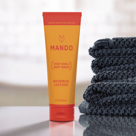 Mando next to a ruler showing 8.5 ounce size for scale and travel