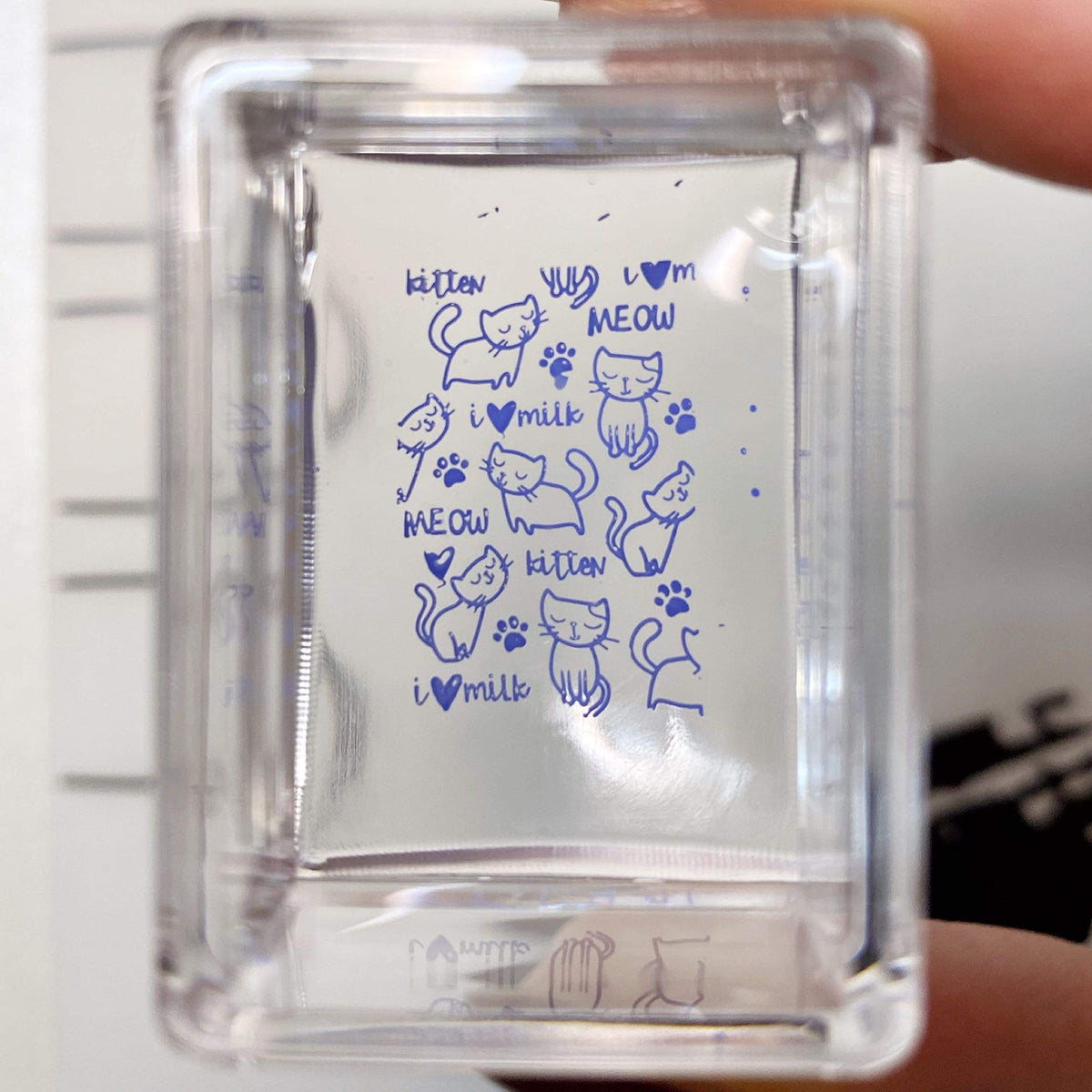 Maniology stamper picking up a design from a metal plate for accurate transfer