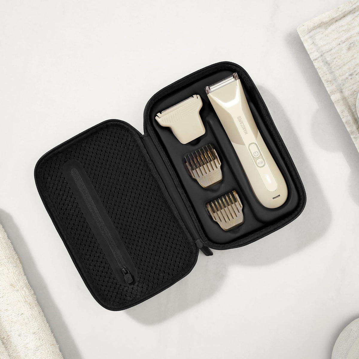 MANSCAPED adjustable combs detail showing 1.4mm fixed and 2–12mm adjustable lengths