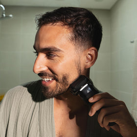 MANSCAPED LED spotlight illuminating neck area for accurate trimming