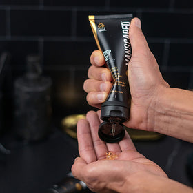 MANSCAPED gel rubbed on hand to show clear, non-foaming protective layer