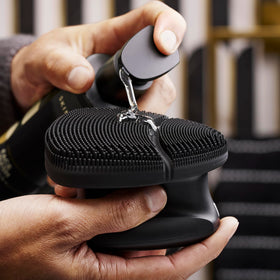 MANSCAPED charging dock and cable showing quick-charge convenience for travel