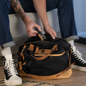 MANSCAPED bottle inside gym bag showing on-the-go odor control and freshness