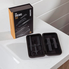 MANSCAPED kit staged in travel bag to show portability and on-the-go grooming convenience