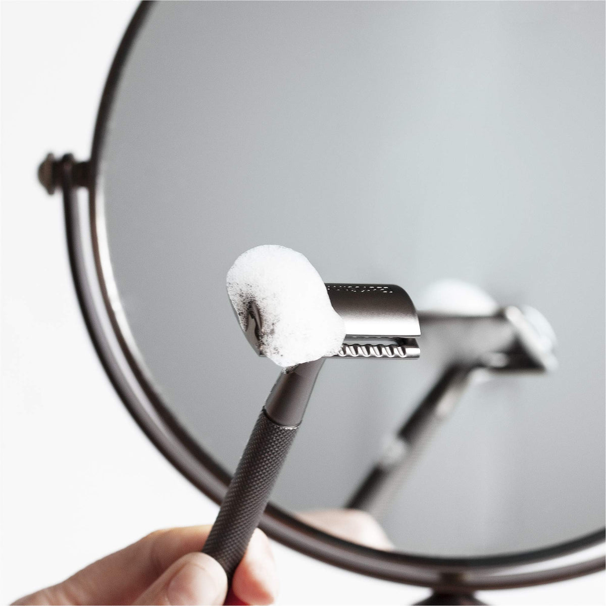 MANSCAPED razor placed beside shaving cream highlighting easy-prep compatibility