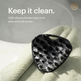 MANSCAPED scalp buffer in shower demonstrating gentle in-shower cleansing