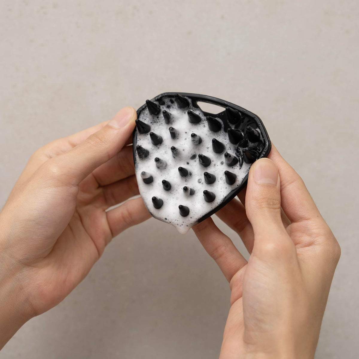 MANSCAPED size comparison in hand showing travel-friendly compact scale
