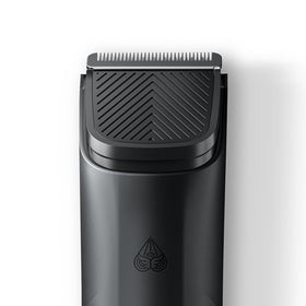 MANSCAPED replacement blade next to coin showing compact size and portability