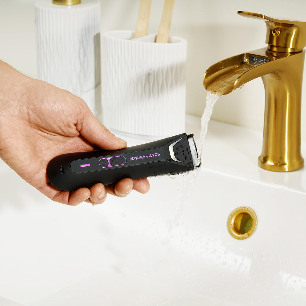 MANSCAPED trimmer with adjustable combs showing length control options