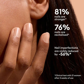Manucurist on natural fingernails in lifestyle shot showing subtle golden glow