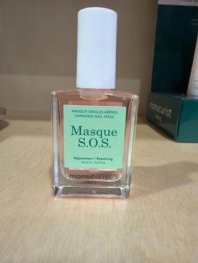 Manucurist kit beside hand for scale communicating travel-friendly nail repair set