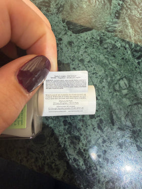 Manucurist serum next to ruler for scale showing compact travel-friendly benefit