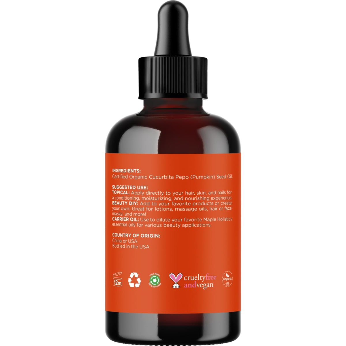 Maple Holistics applying oil to hair ends for hydration and volume