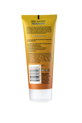 Marc Anthony cream applied to wavy hair, demonstrating soft texture and volume