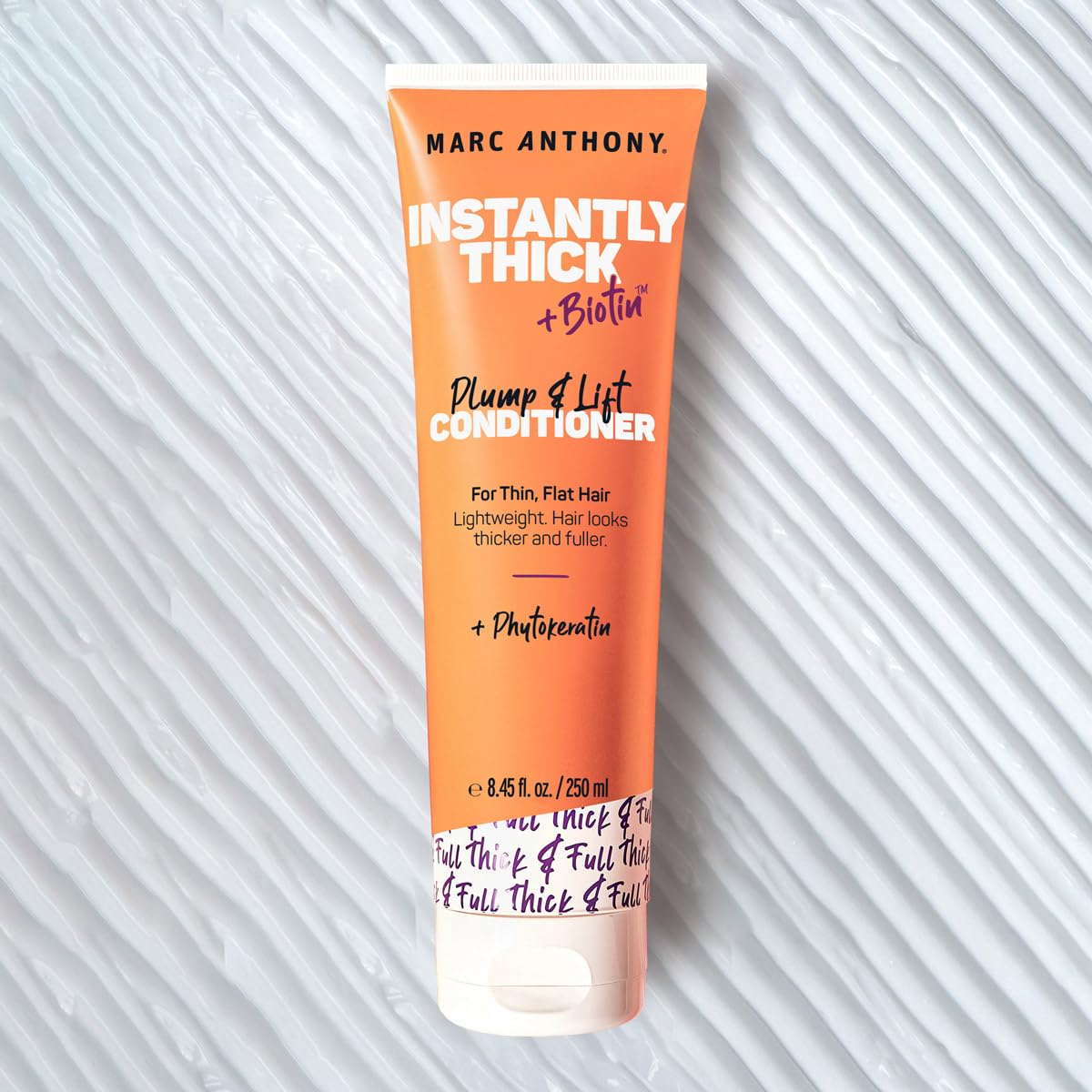 Marc Anthony creamy conditioner texture demonstrating lightweight feel