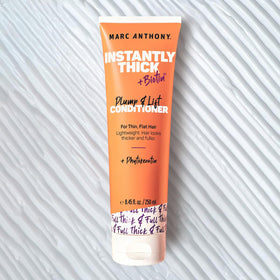Marc Anthony creamy conditioner texture demonstrating lightweight feel