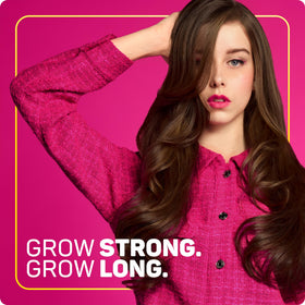 Marc Anthony on curly-haired model showing anti-frizz, smoother styling benefit