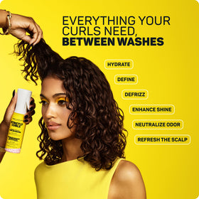 Marc Anthony mist landing on curl texture to hydrate and define strands