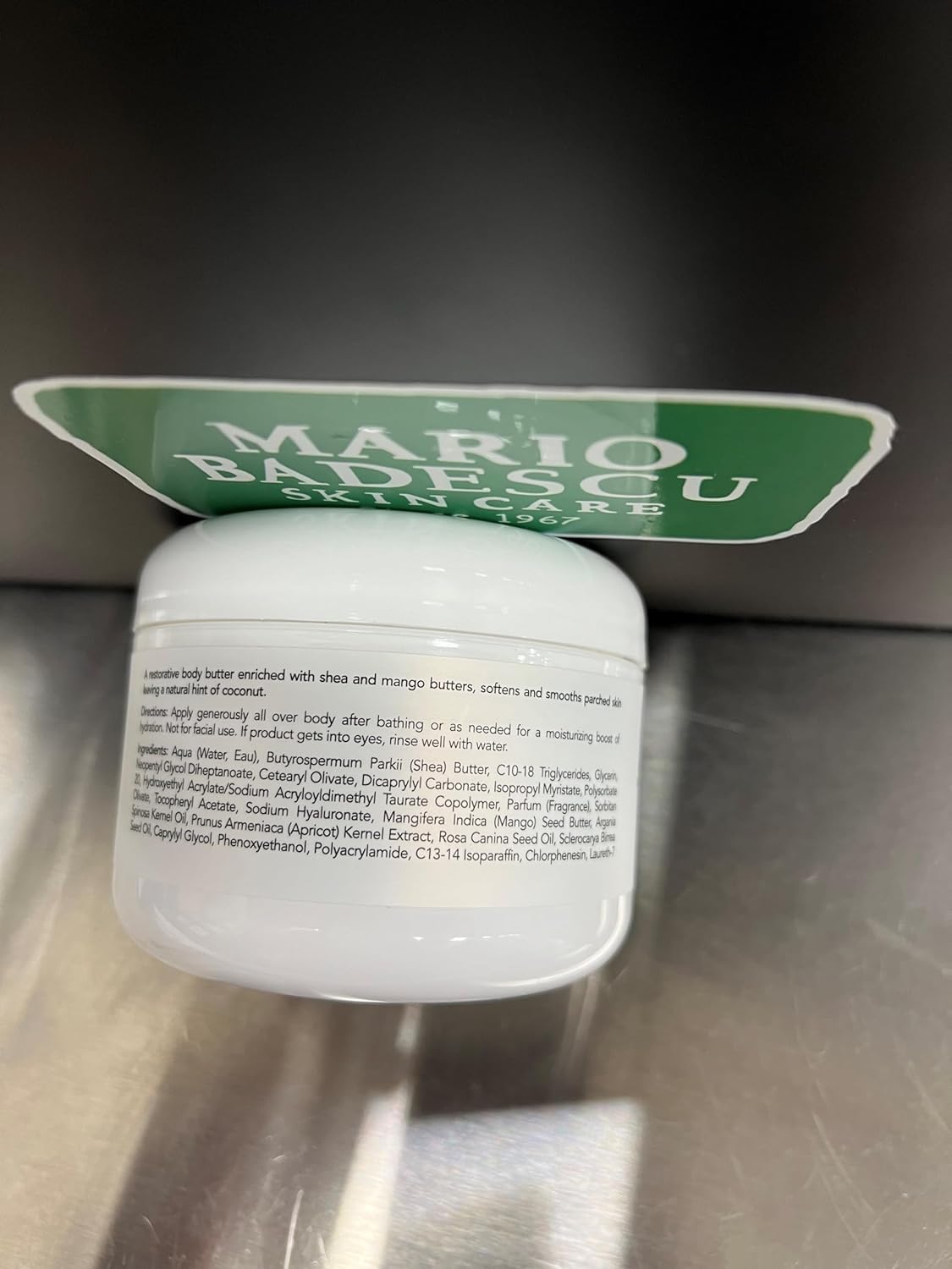 Mario Badescu on bathroom shelf in lifestyle scene suggesting daily post-shower use