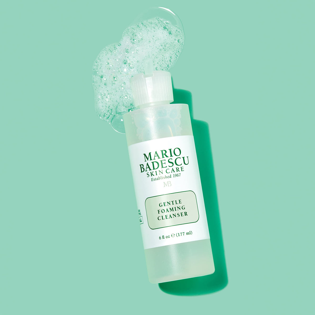 Mario Badescu foaming dispenser producing soft foam, highlights gentle cleansing