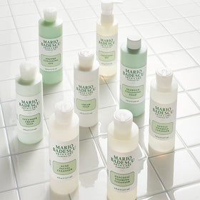 Mario Badescu bottle in hand for size comparison, demonstrates travel-friendly 6 fl oz