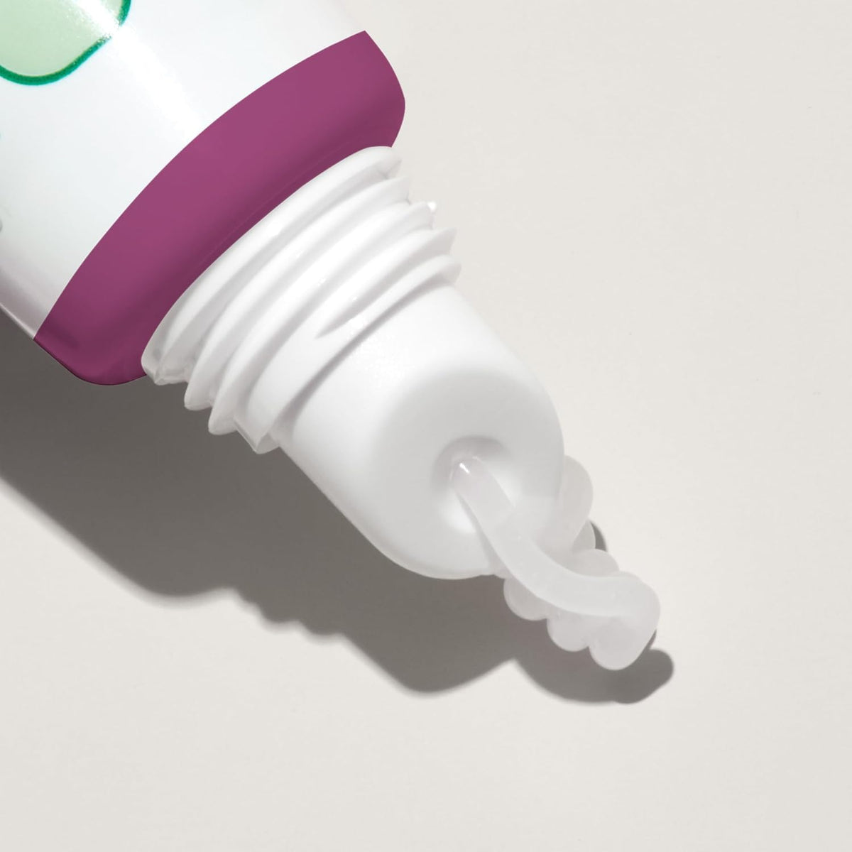 Mario Badescu lip balm held in hand to show compact travel-friendly size