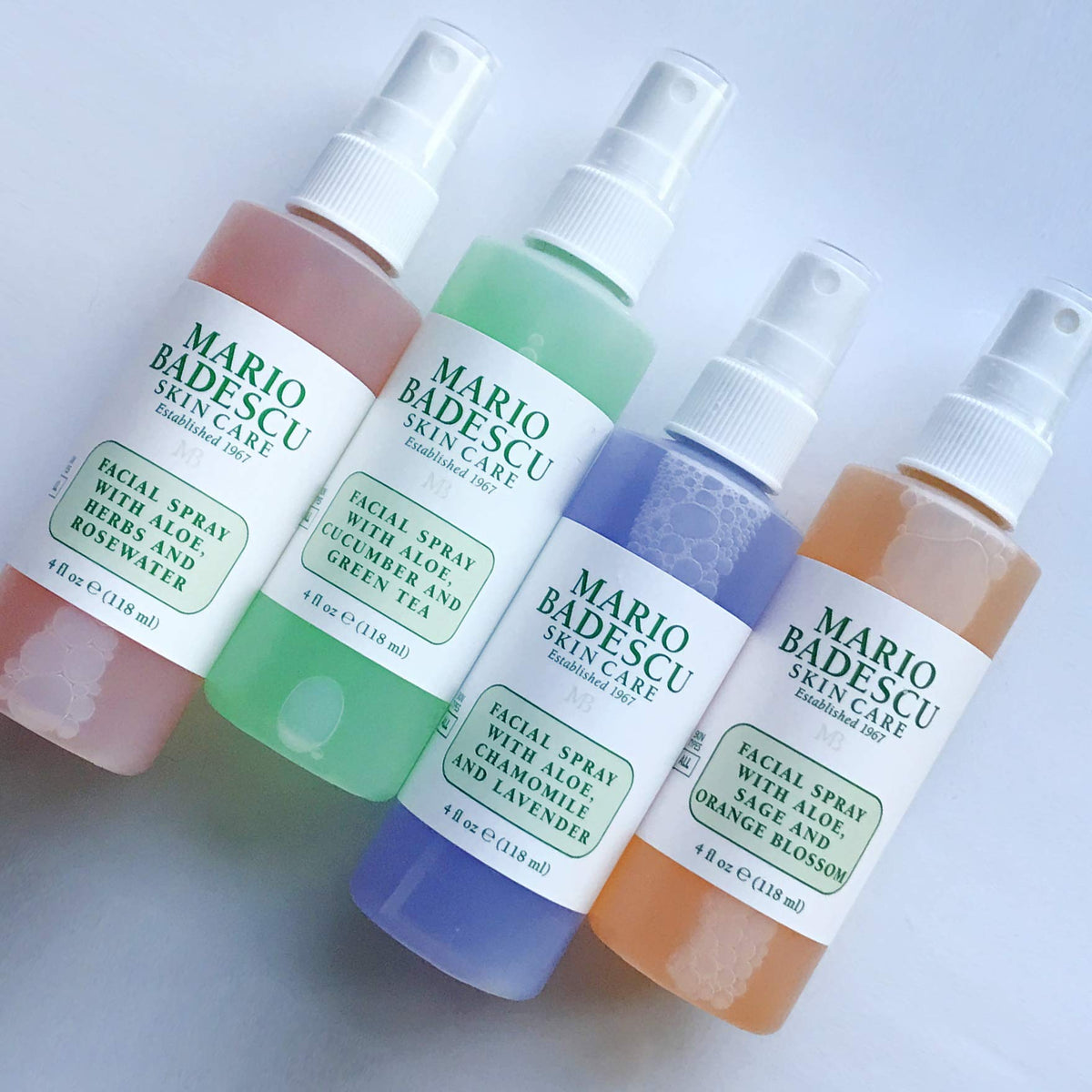 Mario Badescu Lavender 2 oz bottle held to show size and easy portability benefit