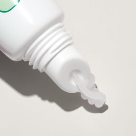 Mario Badescu tube inside a handbag indicating easy everyday carry and quick touch-ups