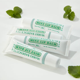 Mario Badescu lip application in hand demonstrating smooth coverage