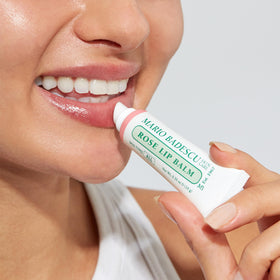 Mario Badescu lip balm inside a purse lifestyle shot for on-the-go nourishment