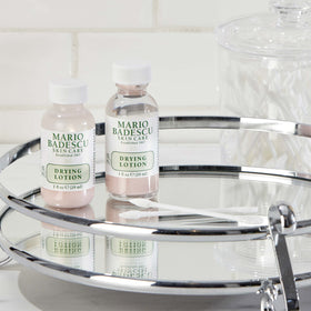 Mario Badescu size comparison beside coin showing travel-friendly one ounce bottle