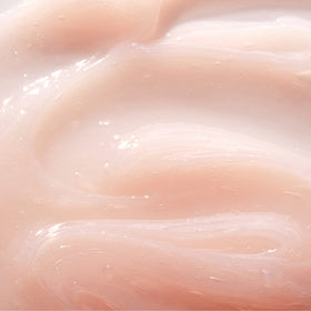 Mario Badescu travel size next to keys showing compact design for on-the-go hydration