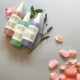 Mario Badescu three sprays next to a ruler to show compact travel size