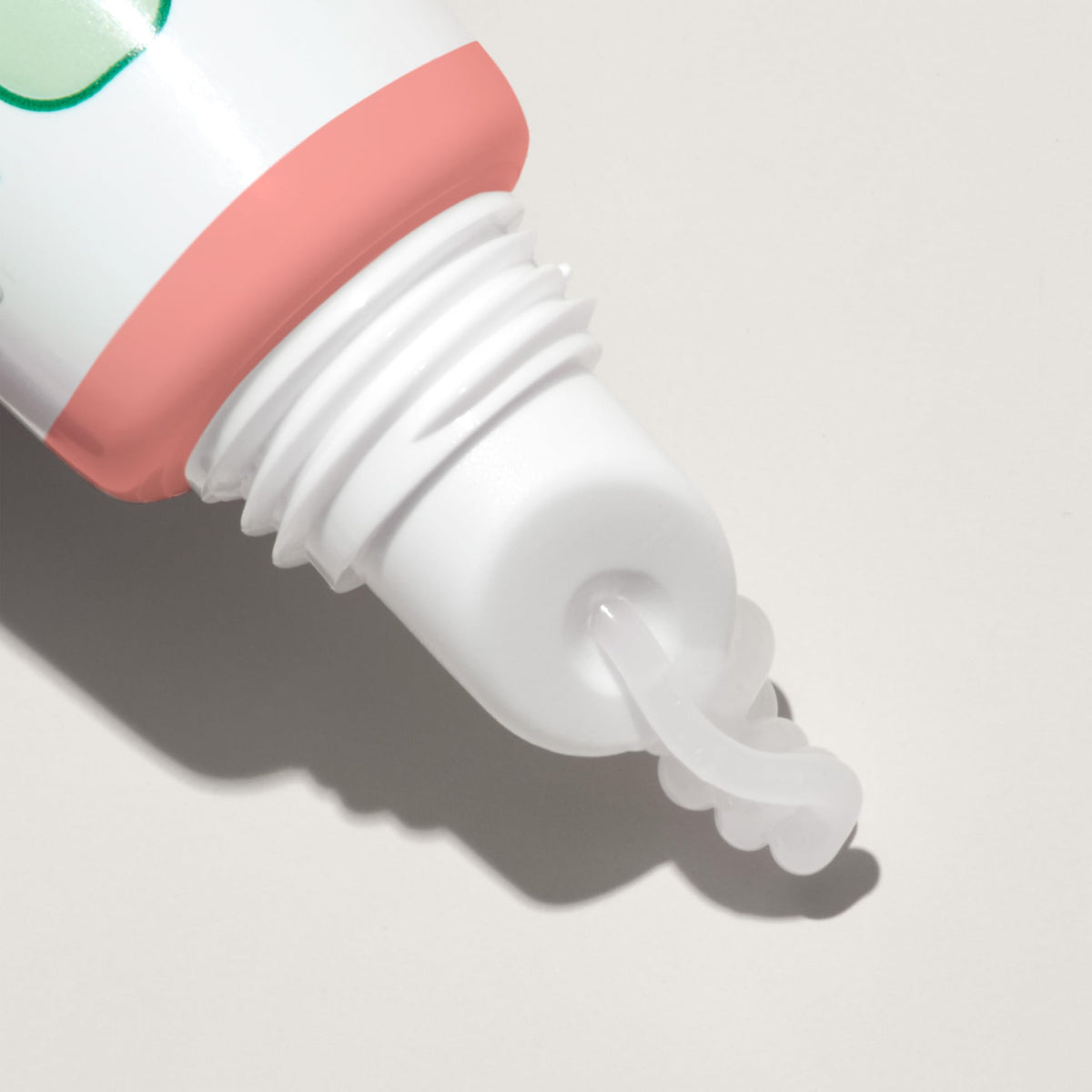 Mario Badescu tube beside lipstick showing compact size for travel convenience